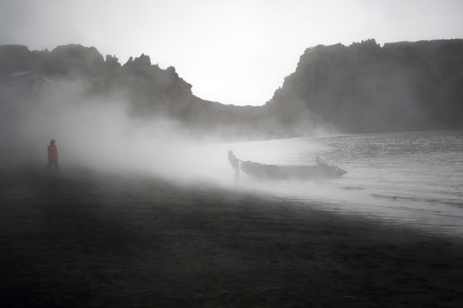 A man disembarks in Deception Island, in the western Antarctic peninsula, on March 05, 2016. antarctica-tourism-environment