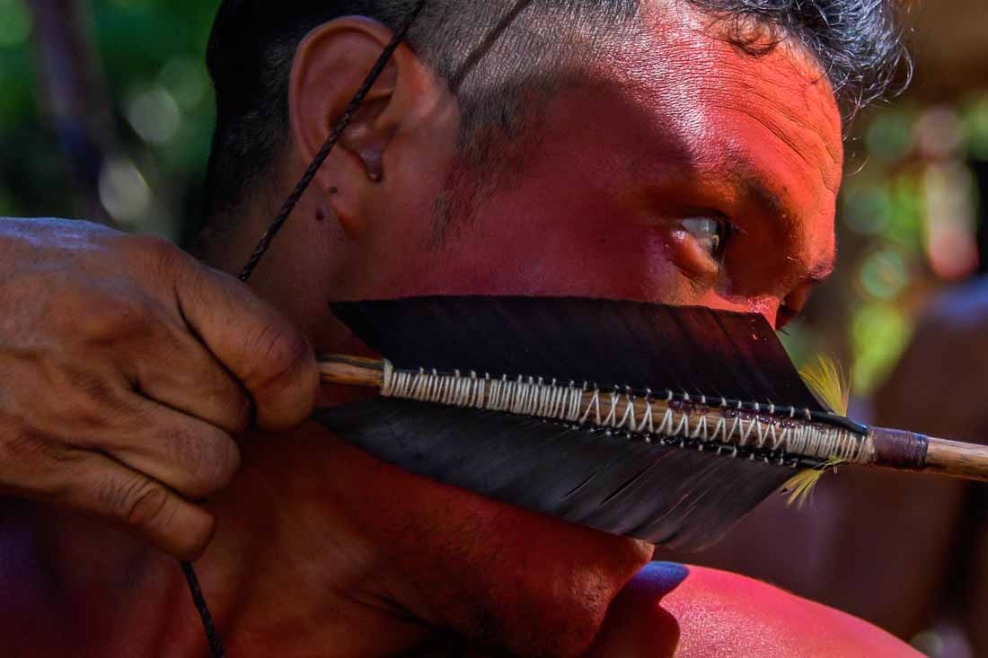 A Waiapi man uses his bow and arrow at the Pinoty village at the Waiapi indigenous reserve on Amapa state, in Brazil, on October 12, 2017. The Waiapi are one of the most traditional tribes in Brazils Amazon, but modern life is getting closer and the