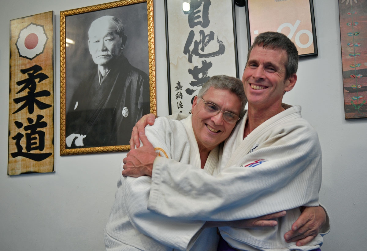 The author and his judo Sensei Oswaldo hug each other, a regular practice at the judo center.