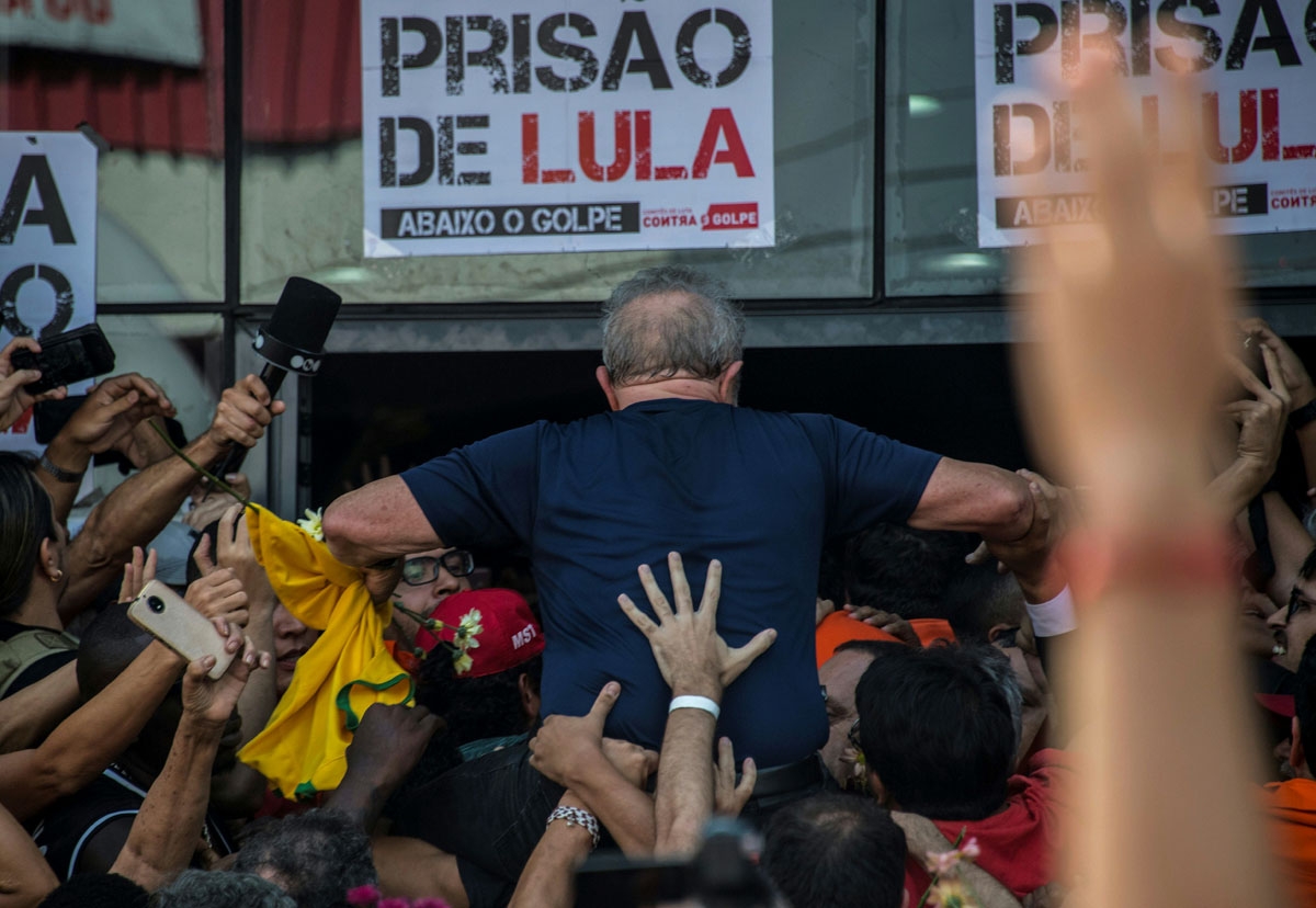 Brazilian ex-president Luiz Inacio Lula da Silva is carried by supporters after attending a Catholic Mass in memory of his late wife in Sao Bernardo do Campo, in Sao Paulo, Brazil, April 7, 2018.