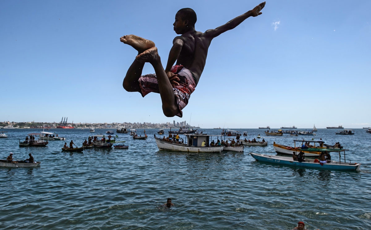 Diving in. A young man jumps into the sea at Boa Viagem beach in Salvador, Bahía, Brazil, on January 1, 2015.