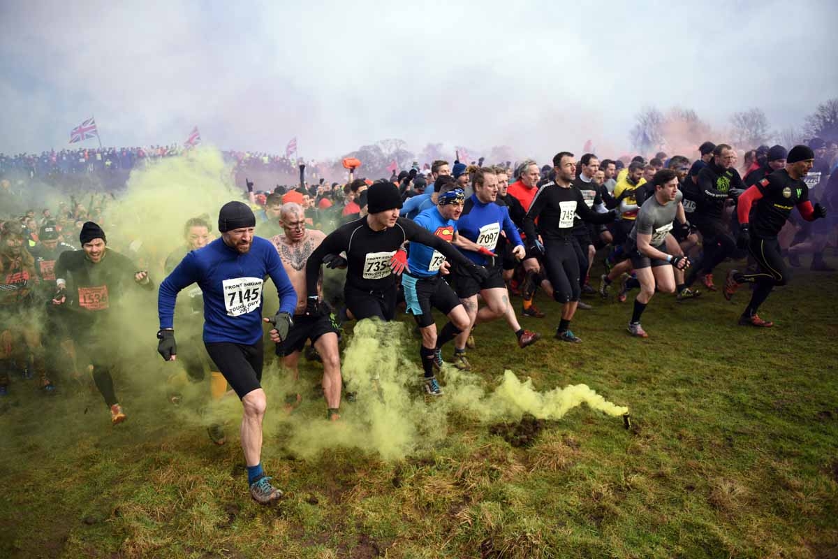 Competitors start the 'Tough Guy' adventure race near Wolverhampton, central England, on January 29, 2017. The Tough Guy event, which is being held for the final time in its 30th year, challenges thousands of competitors to run a gruelling course whilst