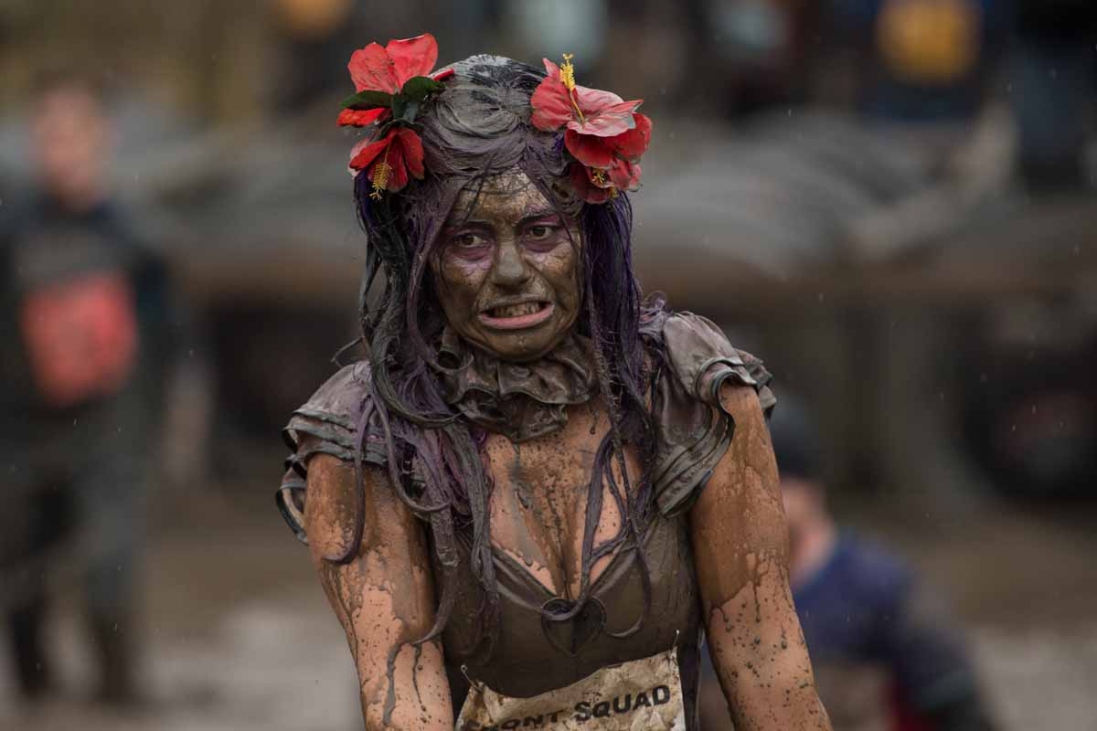 A competitor reacts as she takes part in the 'Tough Guy' adventure race near Wolverhampton, central England, on January 29, 2017. The Tough Guy event, which is being held for the final time in its 30th year, challenges thousands of competitors to run a g