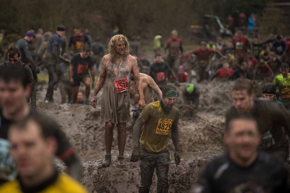 Competitors take part in the 'Tough Guy' adventure race near Wolverhampton, central England, on January 29, 2017. The Tough Guy event, which is being held for the final time in its 30th year, challenges thousands of competitors to run a gruelling course