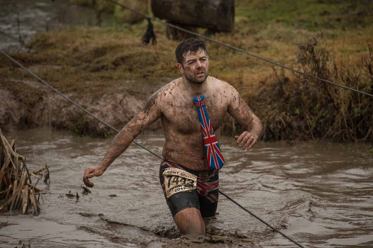 A competitor takes part in the 'Tough Guy' adventure race near Wolverhampton, central England, on January 29, 2017. The Tough Guy event, which is being held for the final time in its 30th year, challenges thousands of competitors to run a gruelling cours