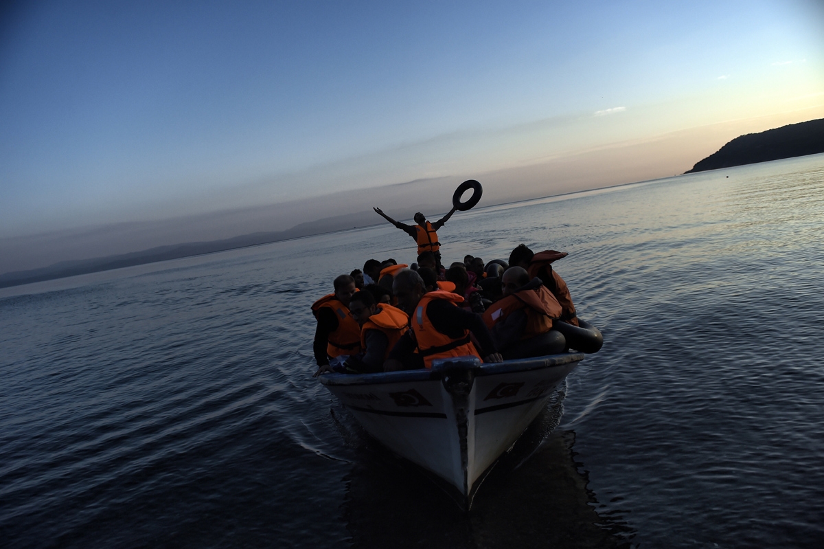 Refugees and migrants arrive to the Greek island of Lesbos after crossing the Aegean sea from Turkey on September 27, 2015. UN Secretary-General Ban Ki-moon welcomed the European Union's decision to inject $1 billion to help countries overwhelmed by Syria