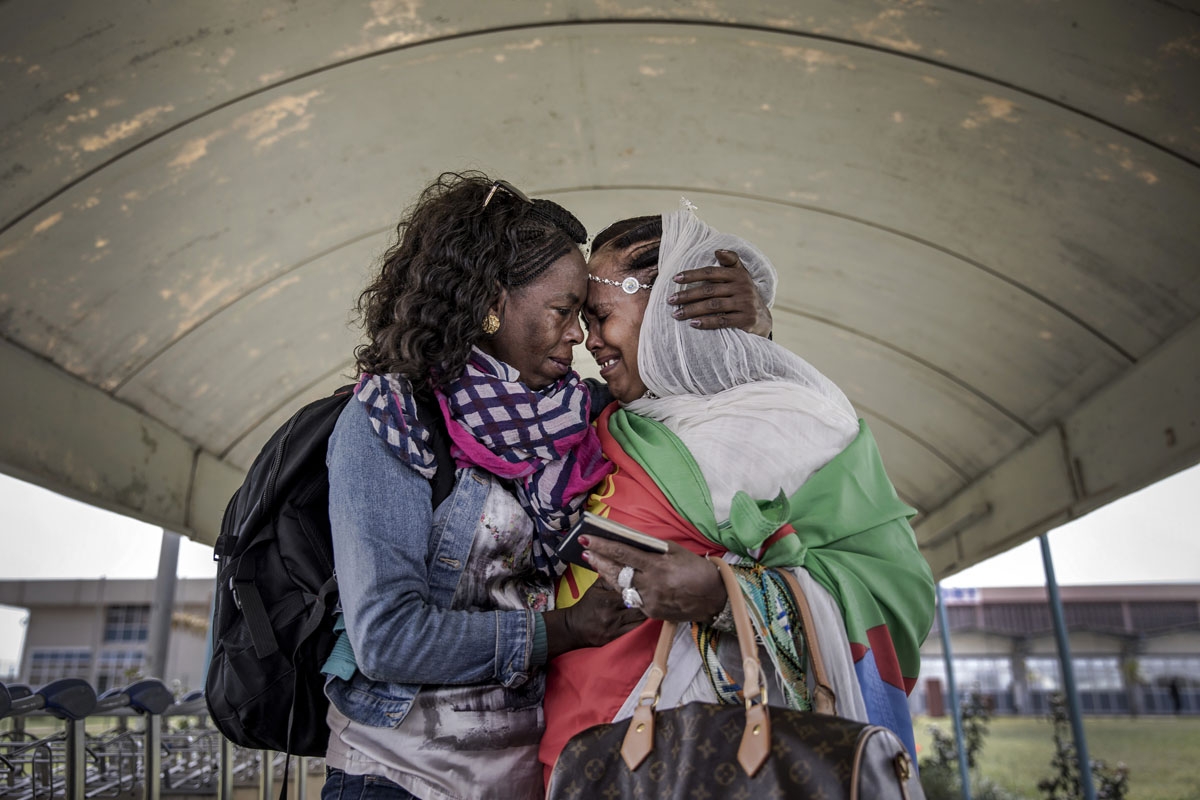 Eritrean sisters reunite after two decades at the airport in the Eritrean capital on July 19,2018, in the wake of resumption of ties between Ethiopia and Eritrea following 20 years of conflict and war that separated families and friends.
