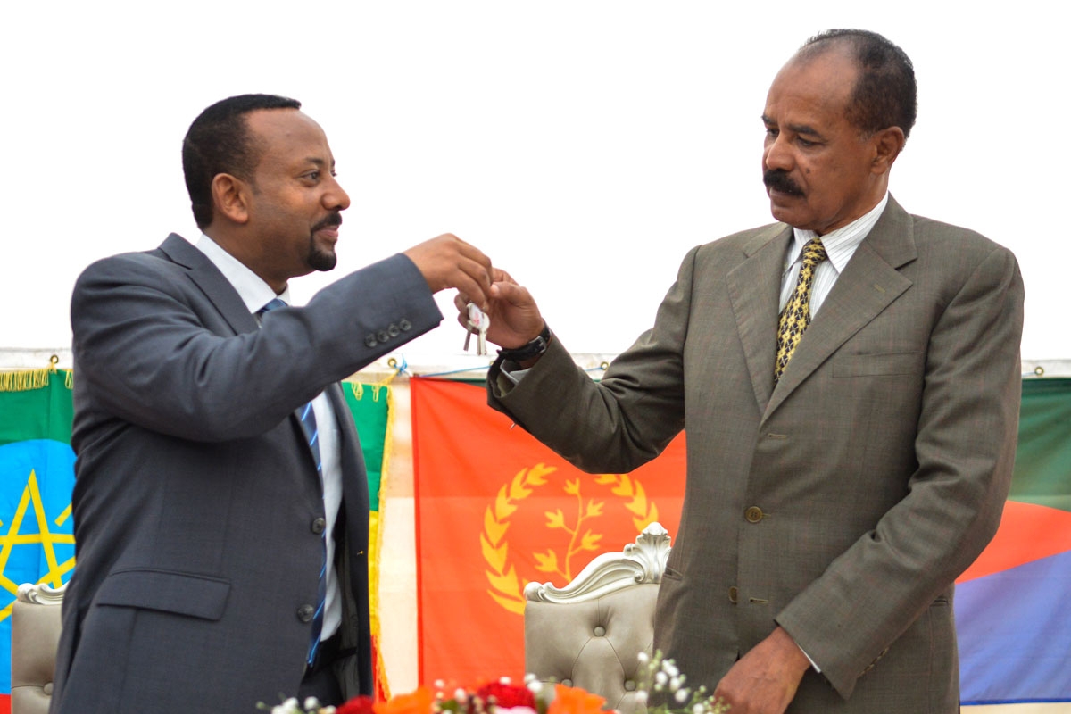 Ethiopian Prime Minister Abiy Ahmed (L) and Eritrean President Isaias Afwerki (R) celebrate the reopening of the Embassy of Eritrea in Ethiopia in Addis Ababa on July 16, 2018.