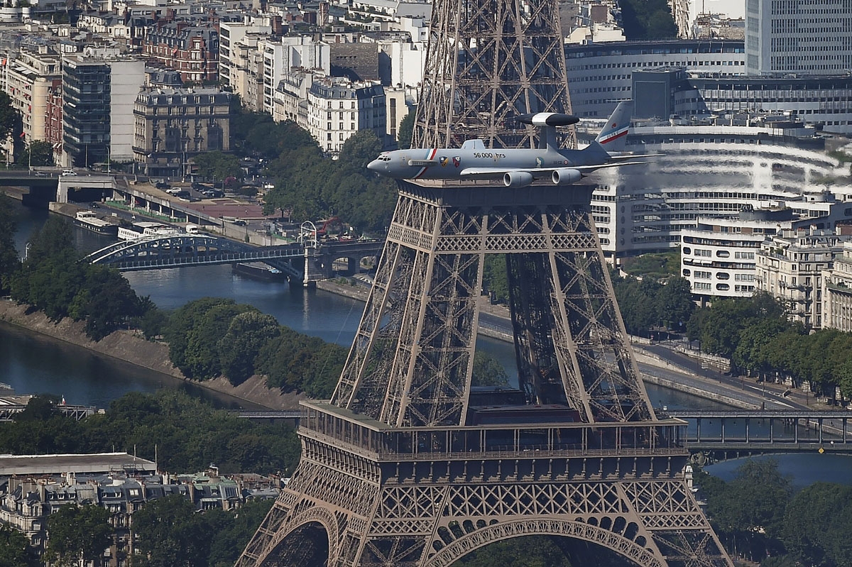 An aerial view shows a French Air Force E-3F Awacs flying past the Eiffel Tower during the annual Bastille Day military parade on the Champs-Elysees avenue in Paris on July 14, 2017.