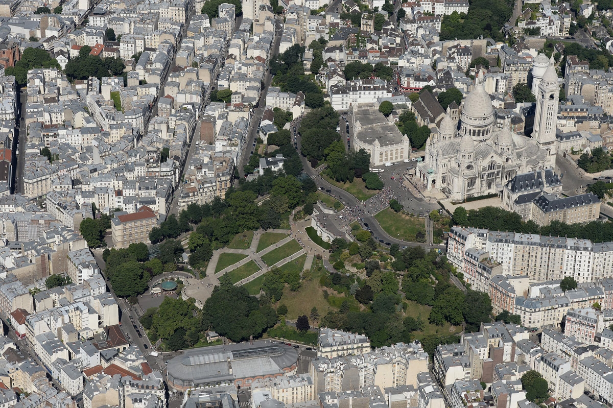 A picture taken on July 14, 2017, in Paris shows an aerial view of the Basilica of the Sacred Heart (Basilique du Sacre-Coeur) located at the summit of the butte Montmartre.