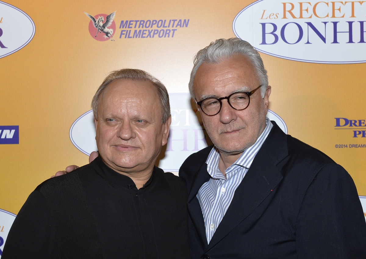 (FILES) In this file photo taken on September 7, 2014 French Chefs Joel Robuchon and Alain Ducasse (R) pose for photographers as they arrive to attend the premiere of the film Les Recettes du Bonheur in Paris.