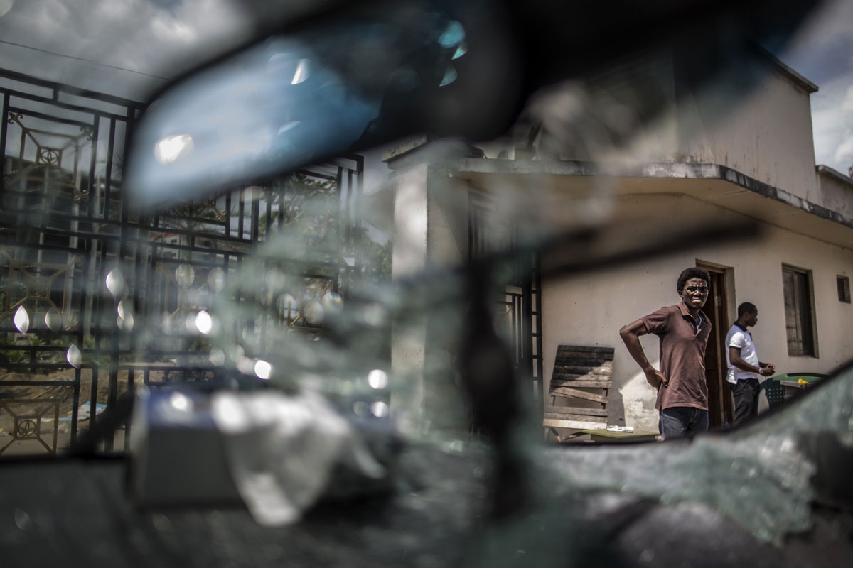 This photo taken on September 3, 2016 in Libreville shows the shattered windscreen of a car inside of Gabon's opposition leader Jean Ping's headquarters. 