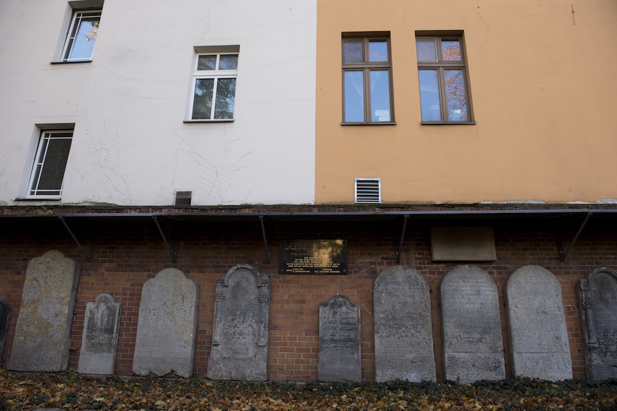 Tombstones are on display October 31, 2013 against a wall of Berlin's oldest Jewish cemetery in the German capital's district of Mitte.