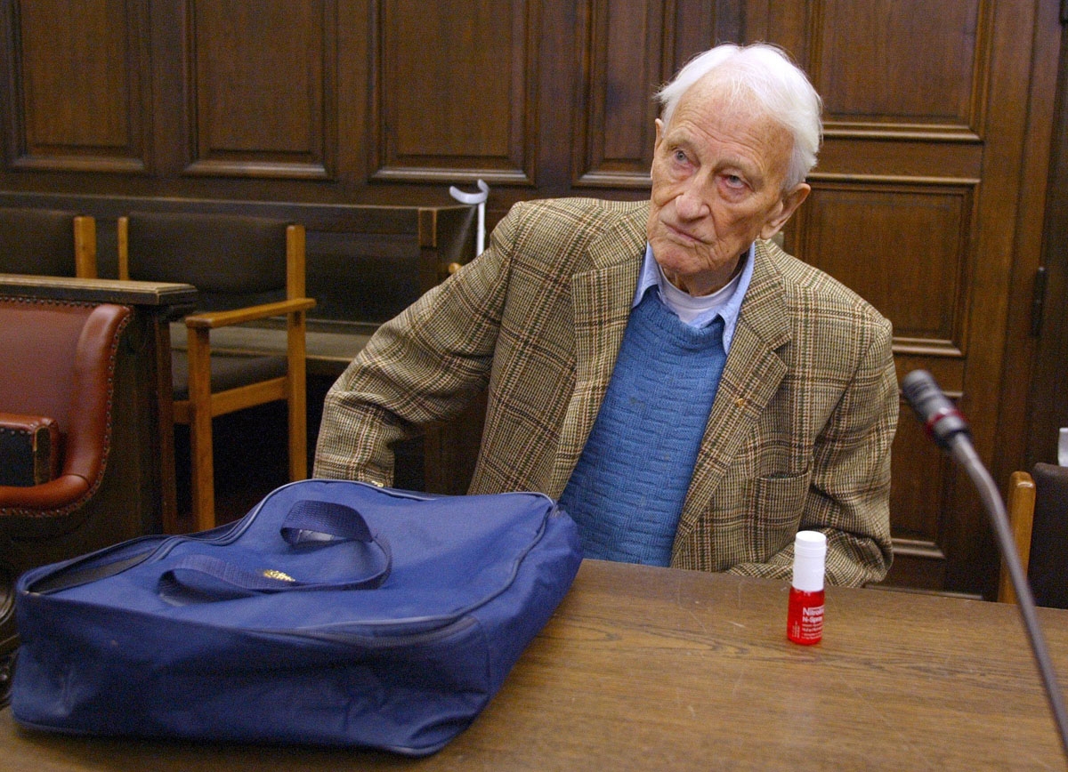 Friedrich Engel, a 93-year-old former Nazi SS officer, sits 12 June 2002 in a Hamburg courtroom before his trial. Engel is charged with ordering the murder of 59 Italian prisoners more than 50 years ago. Dubbed the Butcher of Genoa 