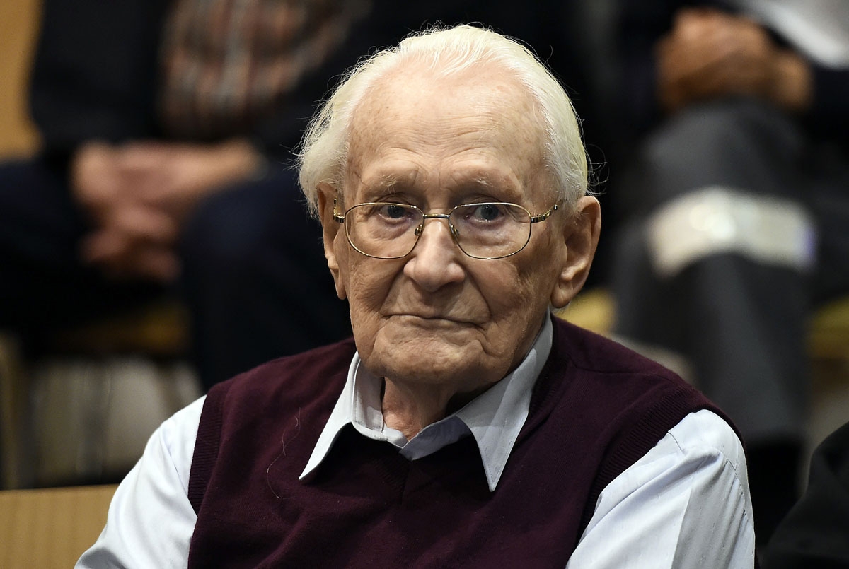 Convicted former SS officer Oskar Groening listens to the verdict of his trial on July 15, 2015 at court in Lueneburg, northern Germany. Oskar Groening, 94, sat impassively as judge Franz Kompisch said the defendant is found guilty of accessory to murder 