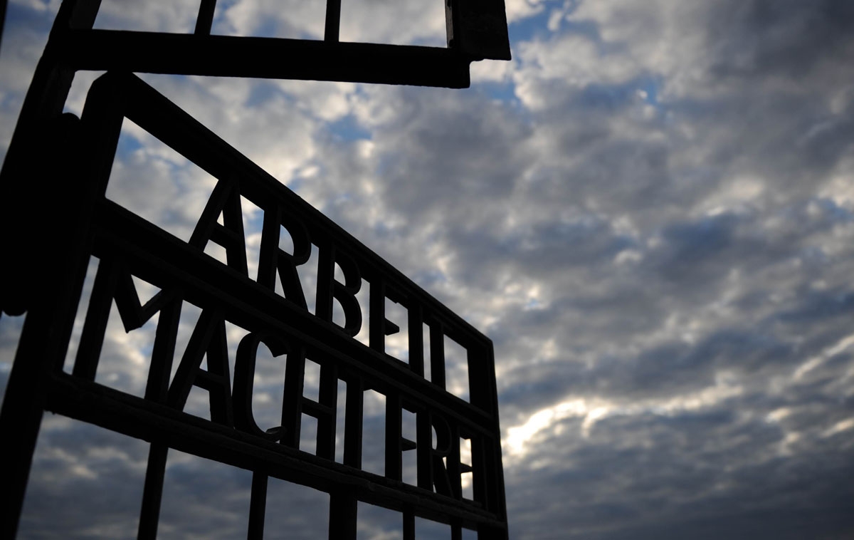 The writing Arbeit Macht Frei (Work Sets You Free) can be seen at the gate of Sachsenhausen concentration camp memorial on September 03, 2010 in Oranienburg, northeastern Germany. AFP PHOTO / 