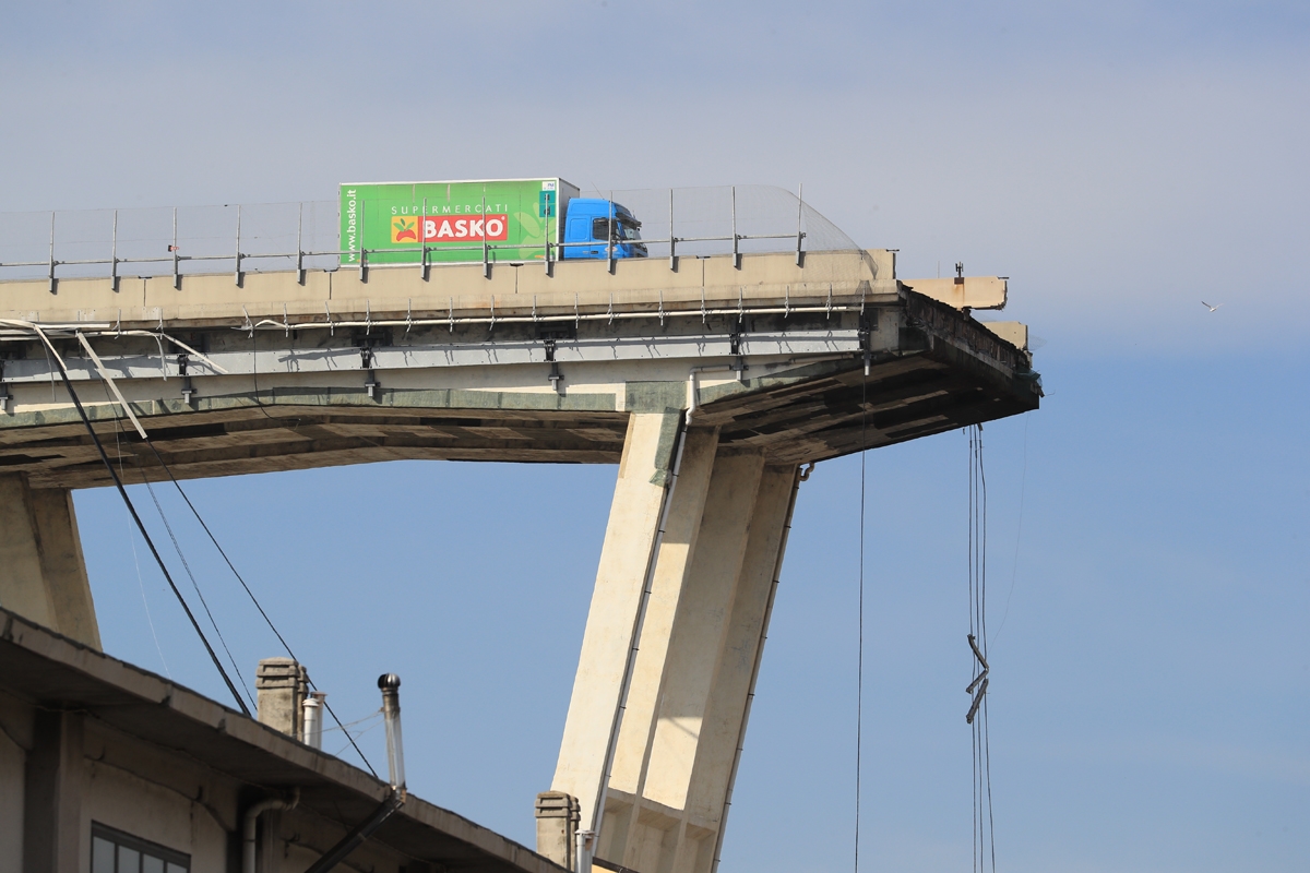 A lorry sits on the Morandi motorway bridge after it collapsed in Genoa on August 14, 2018.