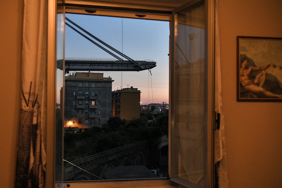 A view onto the Morandi bridge from an apartment in the city a day after the collapse.