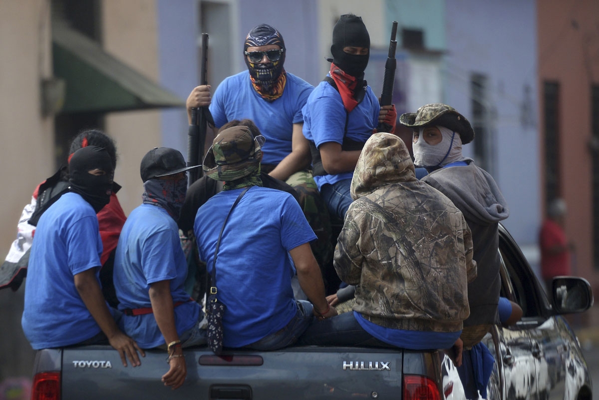 Paramilitaries are seen on trucks at Monimbo neighborhood in Masaya, Nicaragua, on July 18, 2018, following clashes with anti-government demonstrators.