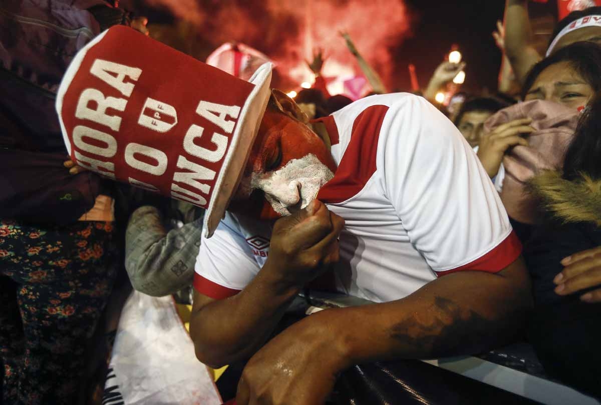 Supporters of Peru celebrate a goal against New Zealand during the 2018 World Cup qualifying play-off second leg football match, at the Plaza Mayor square in Lima, Peru, on November 15, 2017