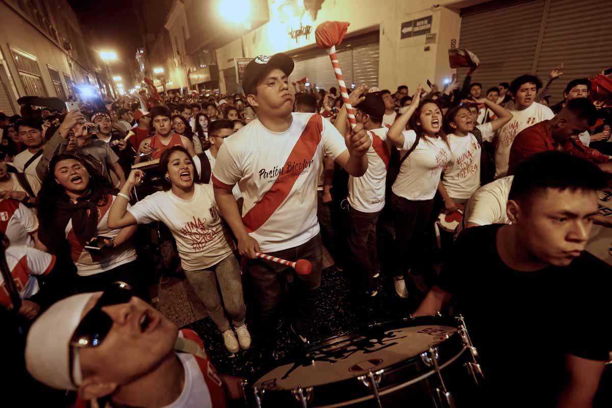 Supporters of Peru celebrate a goal against New Zealand during the 2018 World Cup qualifying play-off second leg football match, at the Plaza Mayor square in Lima, Peru, on November 15, 2017.