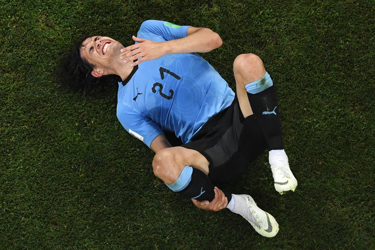 Uruguay's forward Edinson Cavani reacts after being fouled during the Russia 2018 World Cup round of 16 football match between Uruguay and Portugal at the Fisht Stadium in Sochi on June 30, 2018. / AFP