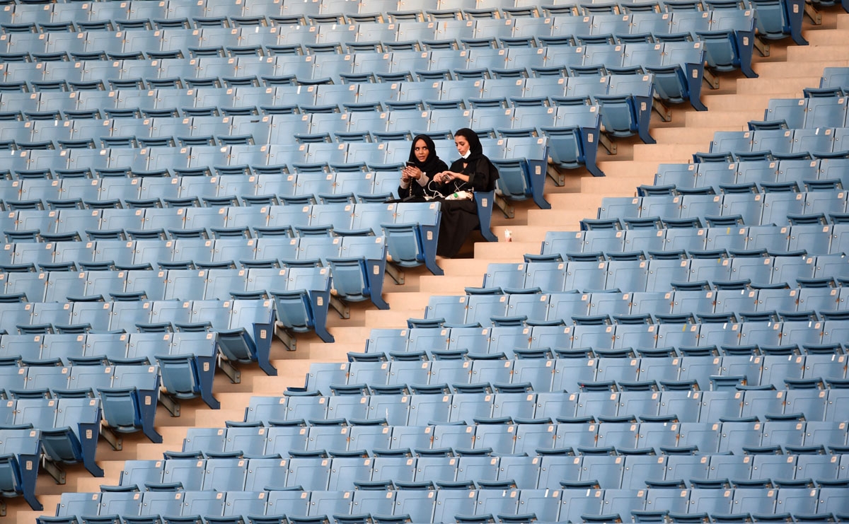 Saudi women sit in a stadium for the first time to attend an event in the capital Riyadh on September 23, 2017 commemorating the anniversary of the founding of the kingdom.