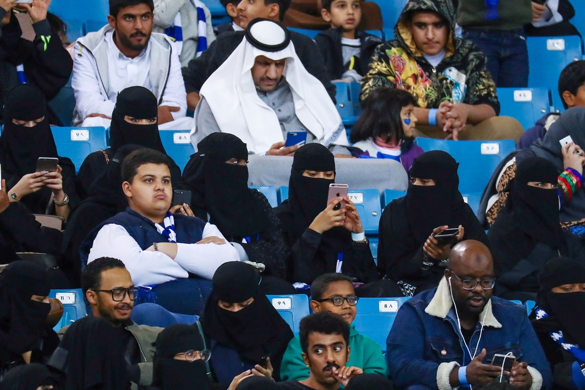 Female supporters of Saudi's Al-Hilal attend their team's football match against Al-Ittihad in the Saudi Pro League at the King Fahd International Stadium in Riyadh on January 13, 2018.