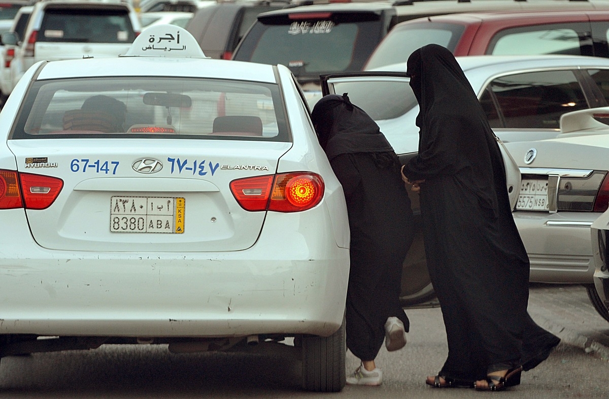 Travelling in pairs -- Saudi women get into a taxi outside a shopping mall in Riyadh on June 22, 2012.