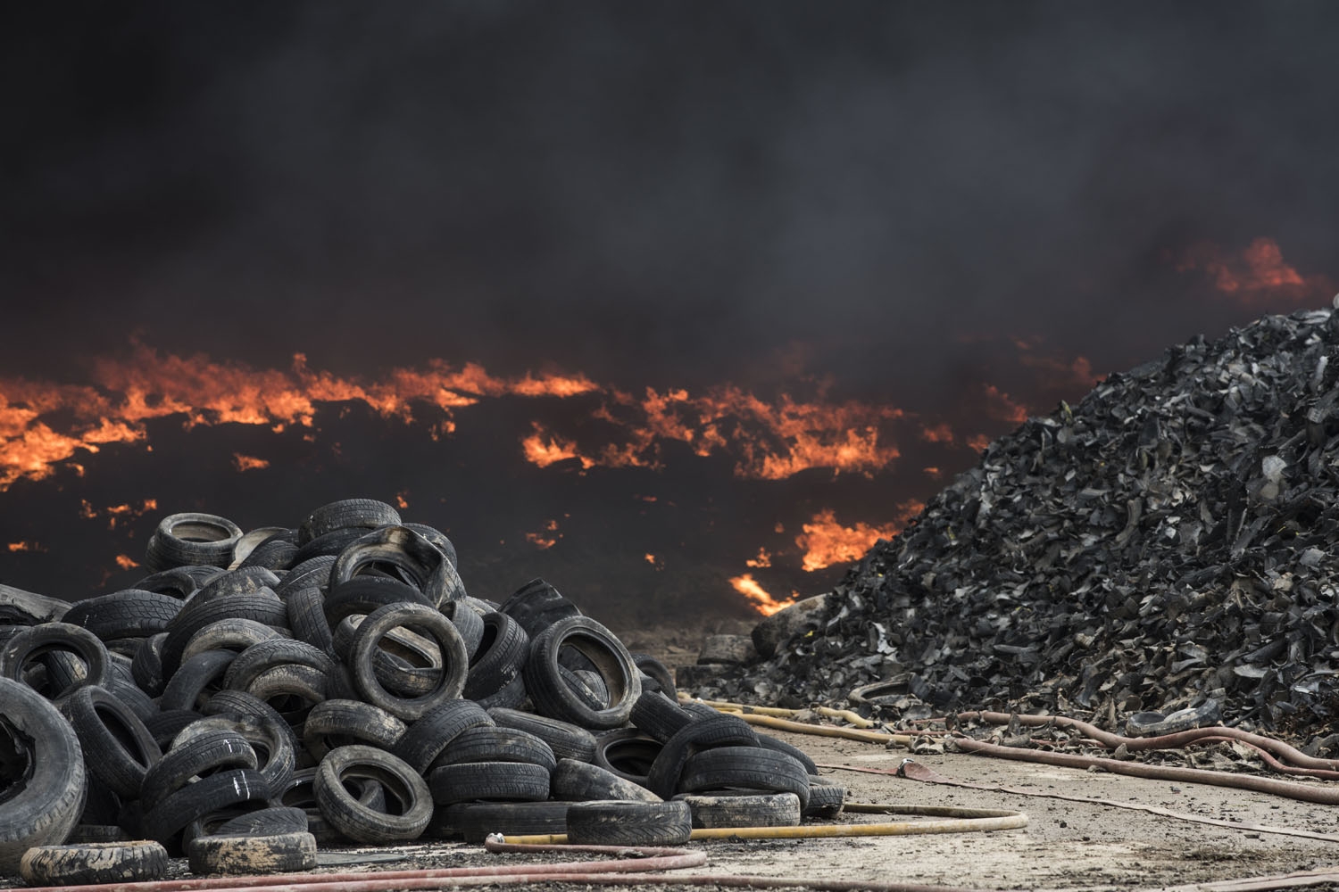 Tyres burn in an uncontrolled dump near the town of Sesena, after a fire brokeout early on May 13, 2016 Tyres burn in an uncontrolled dump near the town of Sesena, after a fire brokeout early on May 13, 2016