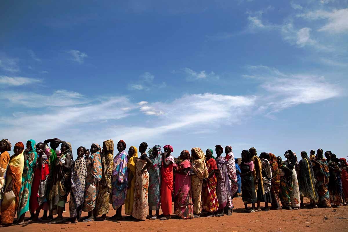 Internally displaced people (IDPs) recently arrived to Wau, South Sudan, due to armed clashes in surrounding villages, wait to be registered by the International Organization for Migration (IOM) and the World Food Programme (WFP) on May 11, 2016.