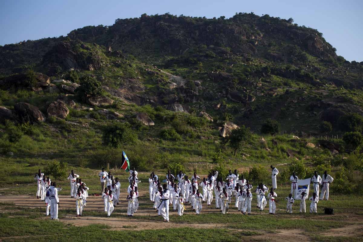 Young boys take part in their daily taekwondo training session at the Juba Jebel (mountain) on June 23, 2016.