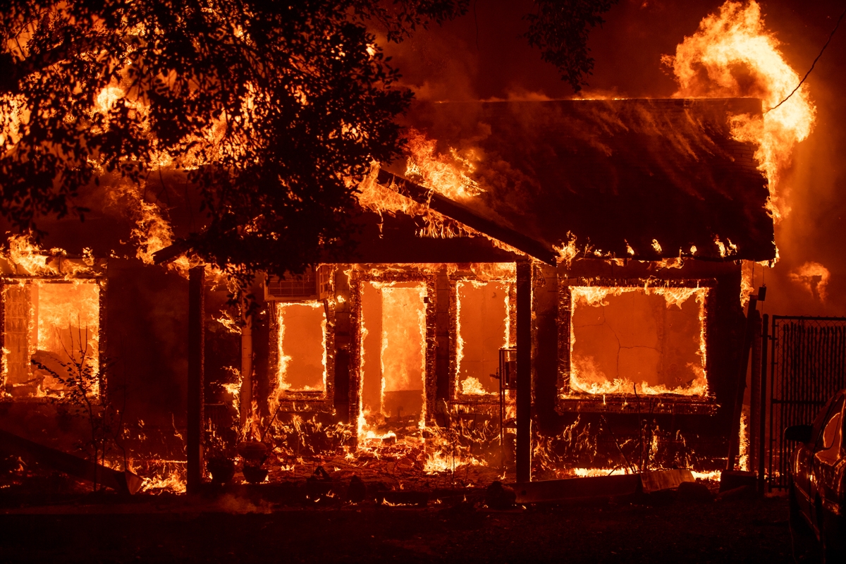 A home burns as the Camp fire tears through Paradise, California on November 8, 2018.