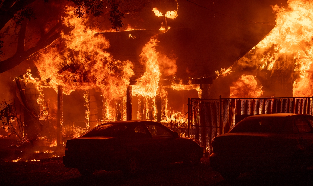 A home burns as the Camp fire tears through Paradise, California on November 8, 2018.