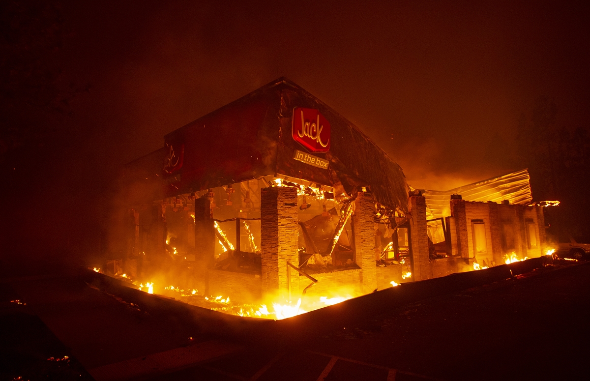 A Jack In The Box fast food restaurant burns as the Camp fire tears through Paradise, north of Sacramento, California.