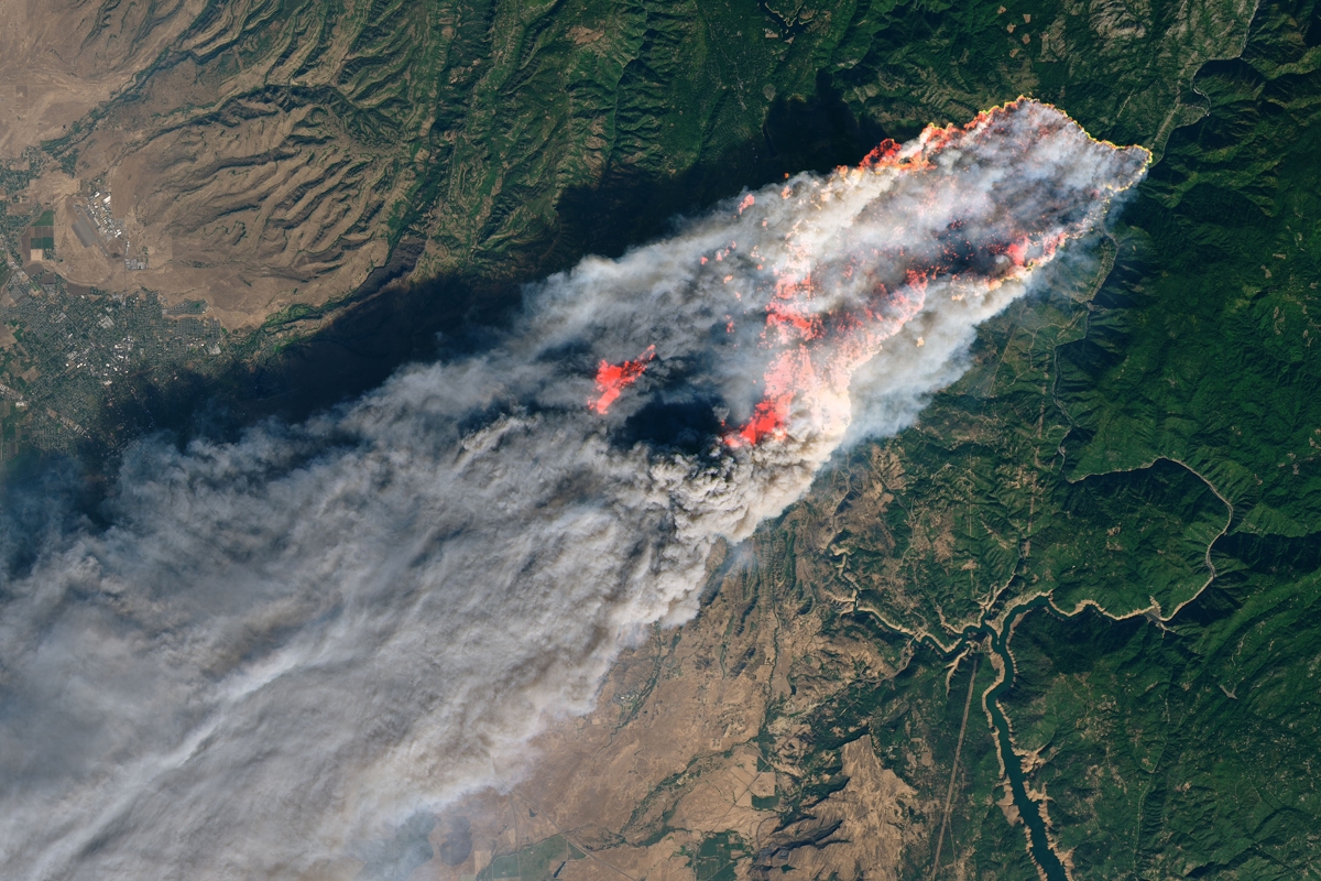 This NASA Earth Observatory handout image taken on November 8, 2018 and released on November 10, 2018 shows the Camp Fire burning in Paradise, California.