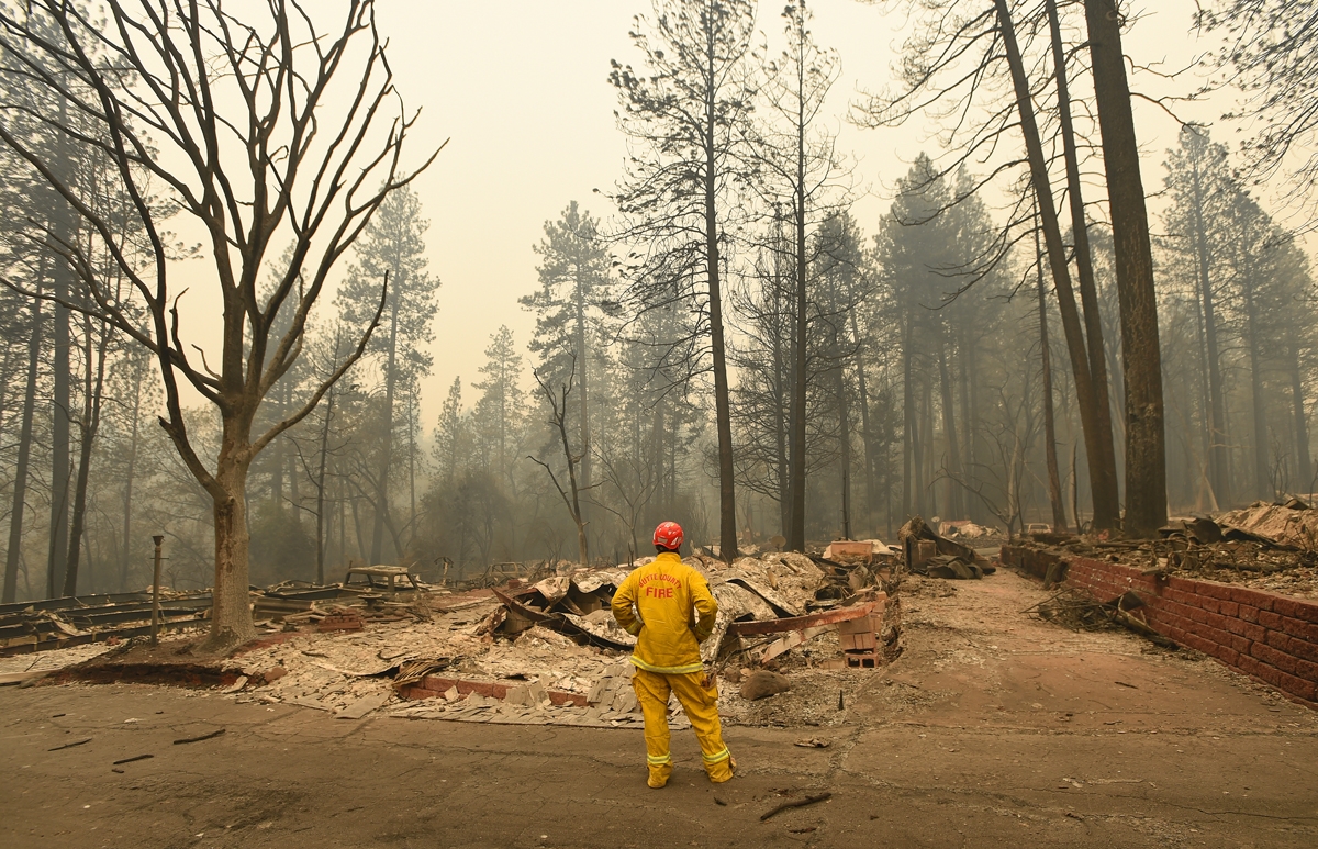 A Butte County firefighter looks over burned properties in Paradise, California on November 14, 2018.