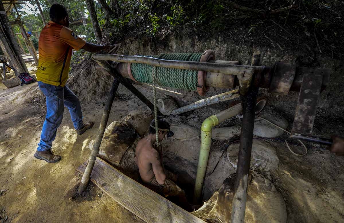 Ender Moreno descends into La Culebra underground gold mine in El Callao, Bolivar state, southeastern Venezuela on March 1, 2017. Although life in the mines of eastern Venezuela is hard and dangerous, tens of thousands from all over the country head for t