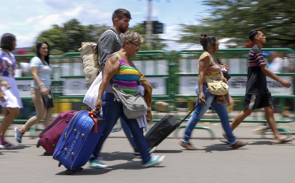 Venezuelans cross the border into Colombia through the Simon Bolivar bridge, August 19, 2018.