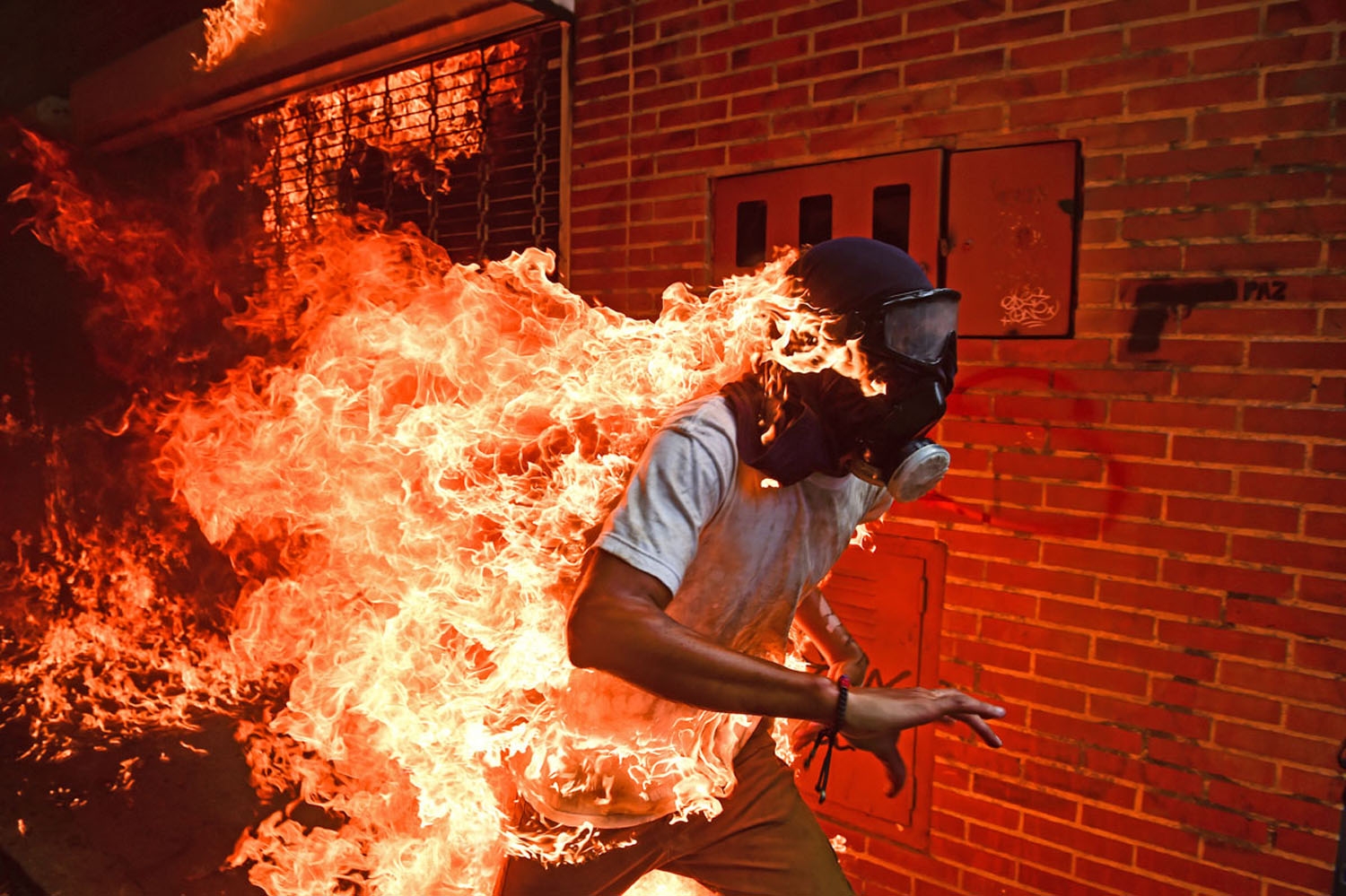 A demonstrator catches fire during clashes with riot police within a protest against Venezuelan President Nicolas Maduro, in Caracas on May 3, 2017.