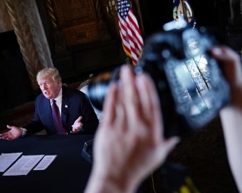 US President Donald Trump speaks to the press after talking to members of the military via teleconference from his Mar-a-Lago resort in Palm Beach, Florida, on Thanksgiving Day, November 22, 2018. (Photo by Mandel NGAN / AFP)